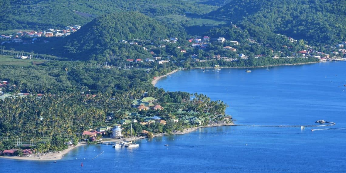 Scenic bay in Martinique with French colonial architecture and mountains