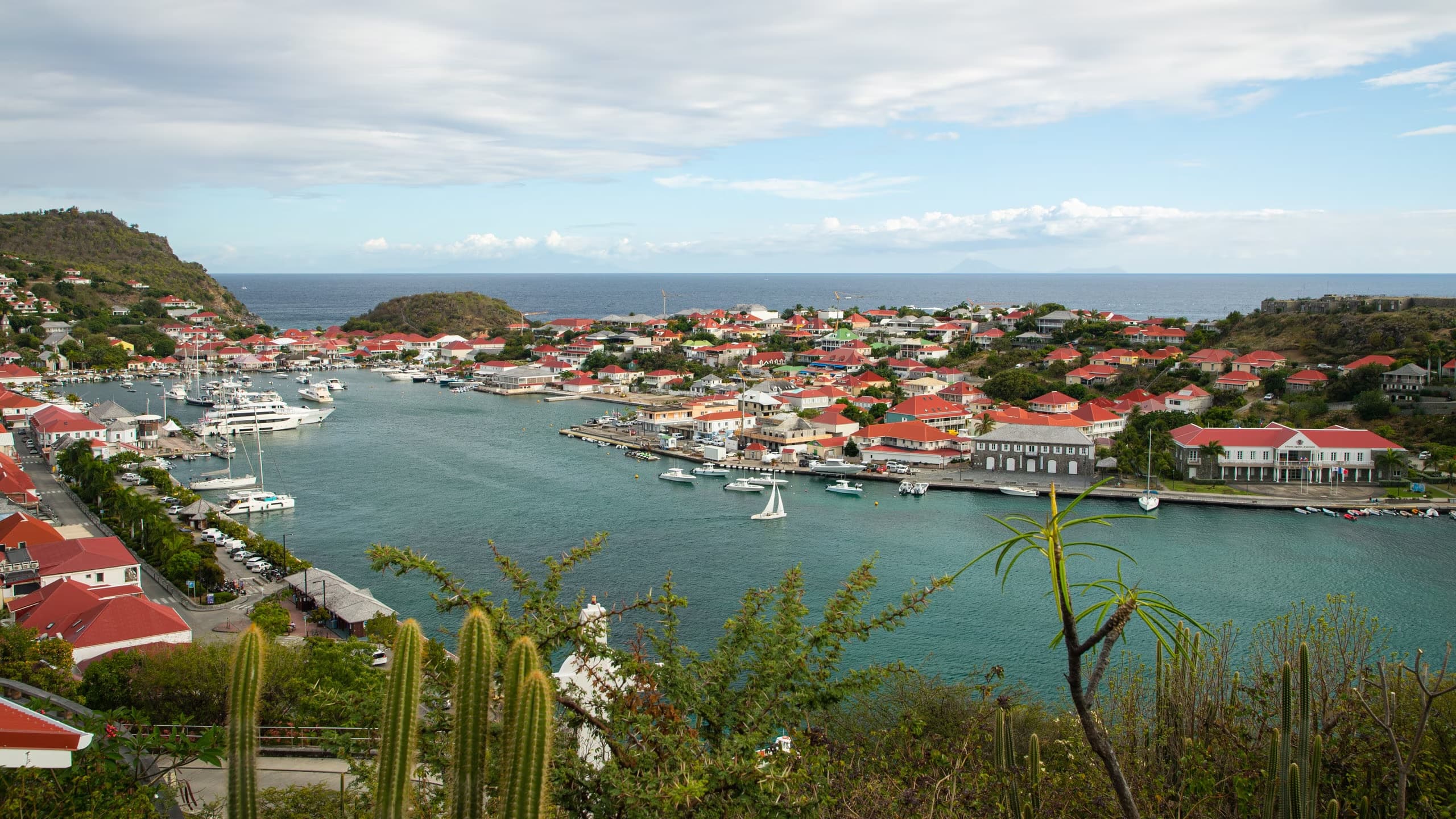 Aerial view of Gustavia Harbor, St. Barts, with luxury yachts and beautiful Caribbean scenery